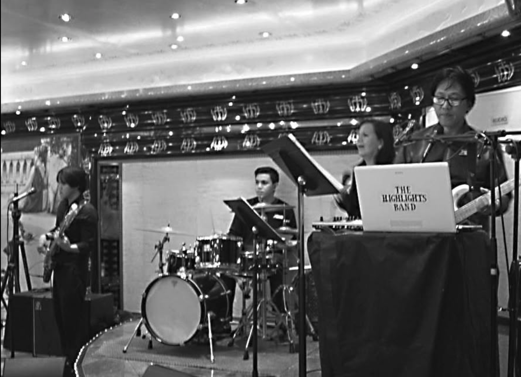 The Highlights Band performing live in a cruise ship lounge with Resty Garcia on guitar and vocals